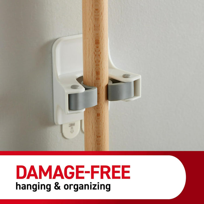 Command Broom and Mop Grippers, 2 Hangers and 4 Command Strips, Damage-Free Hanging Wall Mount Broom and Mop Holder, Household Cleaning Organizer for Organization and Storage, Holds up to 4 lb
